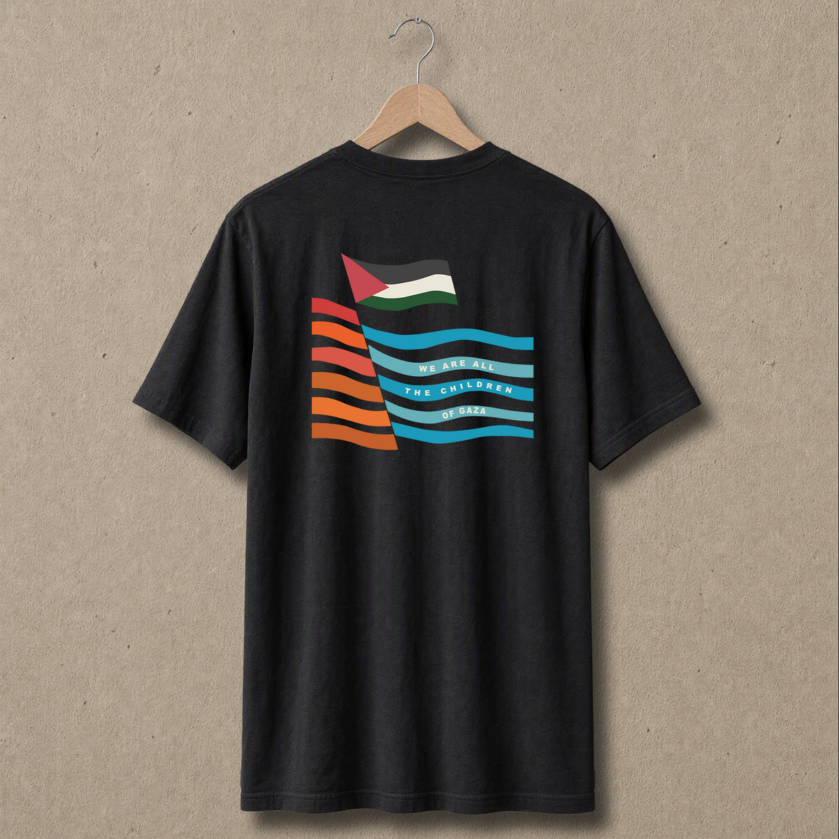Back view of black Children of Gaza Palestinian T-shirt featuring a large multicolor flag-inspired graphic with the words “We Are All the Children of Gaza.”