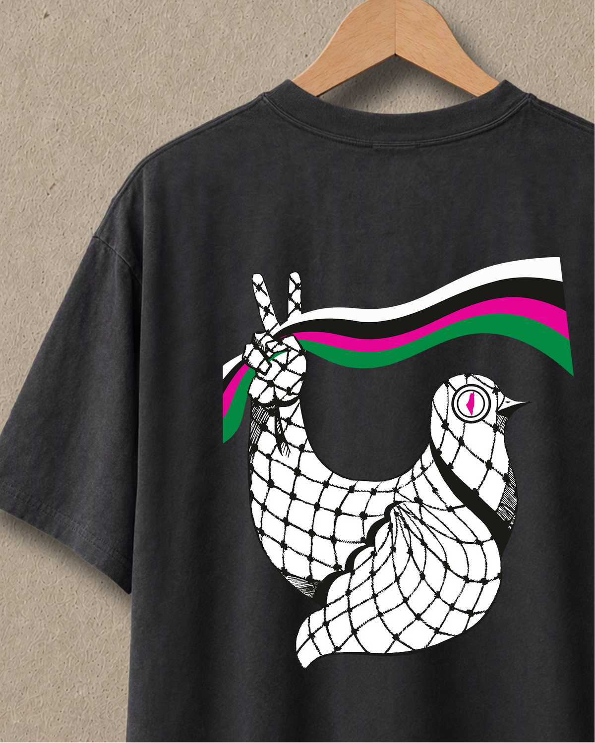 Heavyweight faded black Dove T-shirt shown from the back with Palestinian artwork in a close-up product view