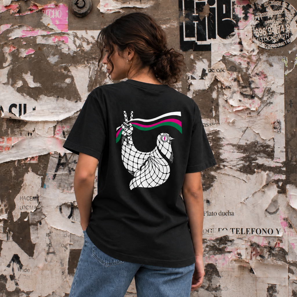 Woman wearing a black regular fit Palestinian T-shirt with Dove artwork on the back
