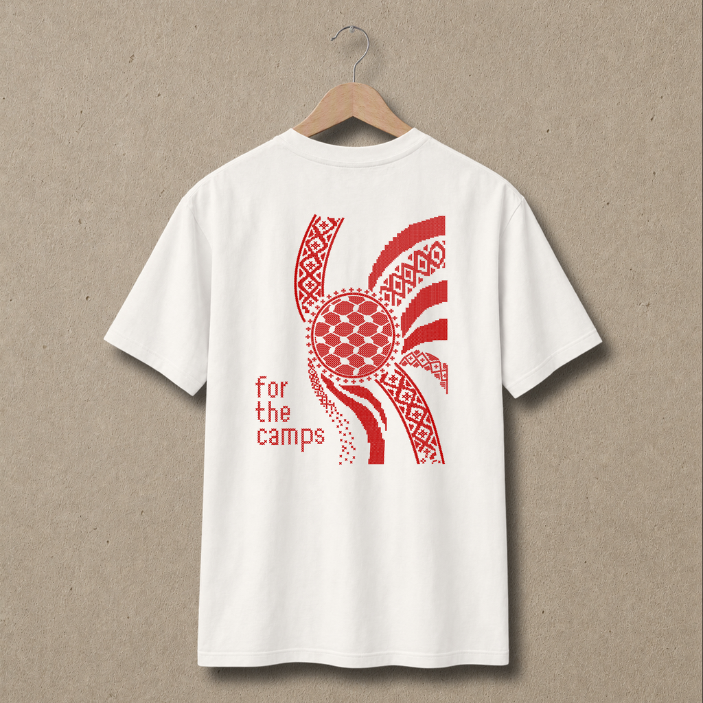 Back view of natural For the Camps Palestinian T-shirt featuring a large red tatreez-inspired graphic, keffiyeh-pattern circle and “for the camps” text.
