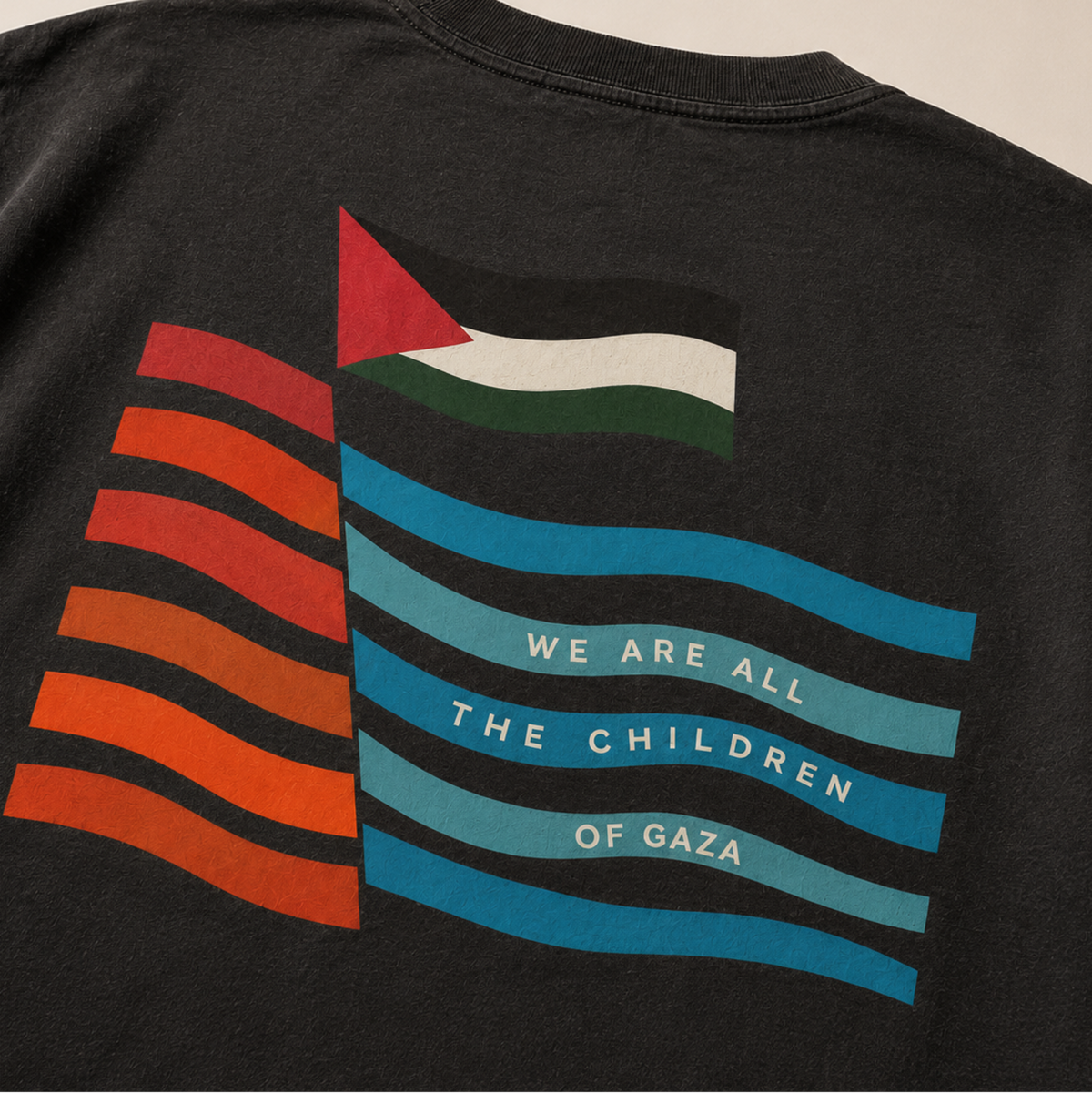 Close-up of the For the Children heavyweight black T-shirt artwork featuring a Palestinian flag, colorful wave design, and “We Are All the Children of Gaza” text.