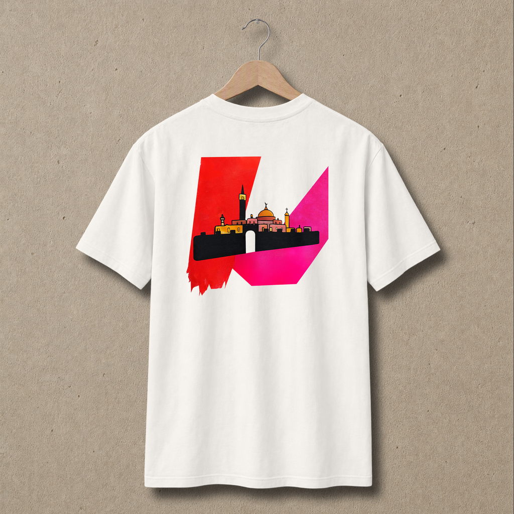 Back view of natural In Jerusalem Palestinian T-shirt featuring a large abstract Jerusalem skyline graphic in red, pink, black and gold.