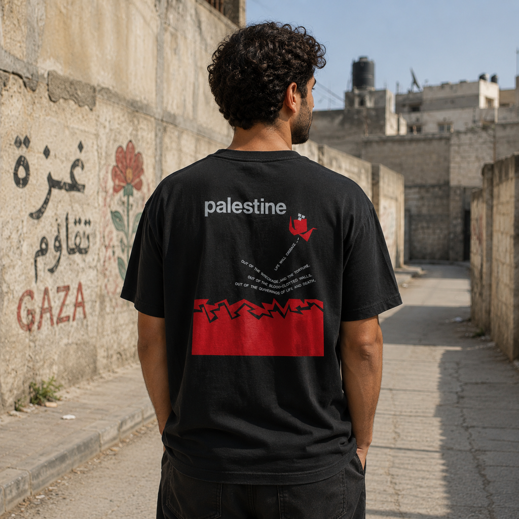 Back view of faded black heavyweight Life Will Emerge Palestinian T-shirt featuring red, gray and white graphic artwork.