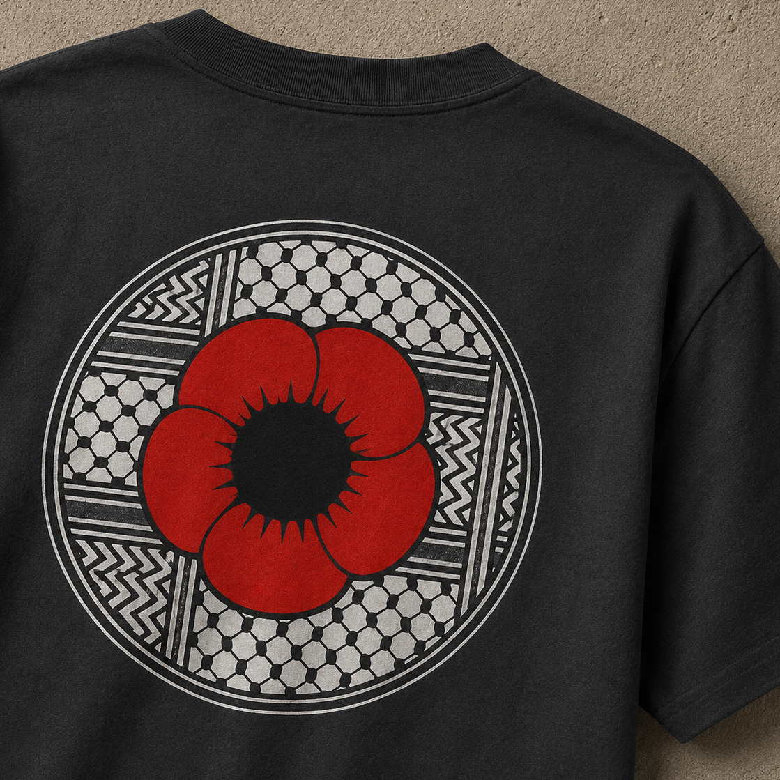 Close-up of black heavyweight Palestinian Poppy T-shirt with red poppy and keffiyeh-pattern circular back graphic.